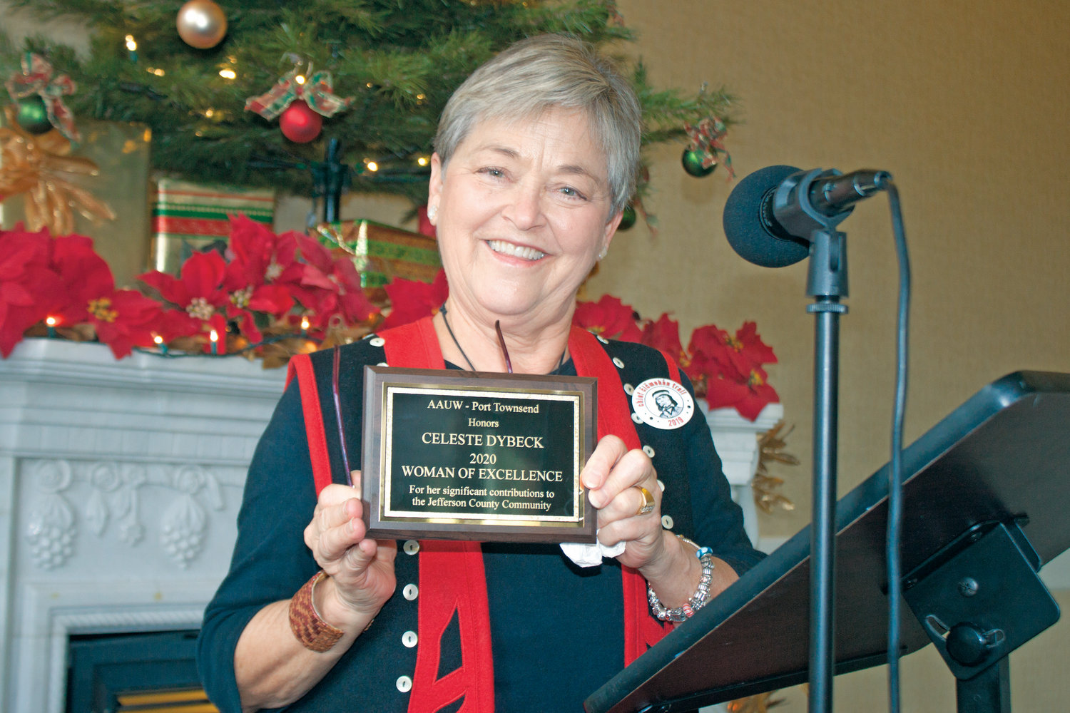 Celeste Dybeck receives her 2020 Woman of Excellence plaque from the American Association of University Women’s Port Townsend branch on Dec. 14.